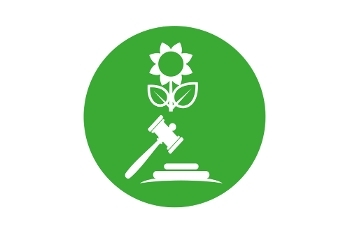 A green circle containing a white illustration of a flower and a gavel (a small hammer).